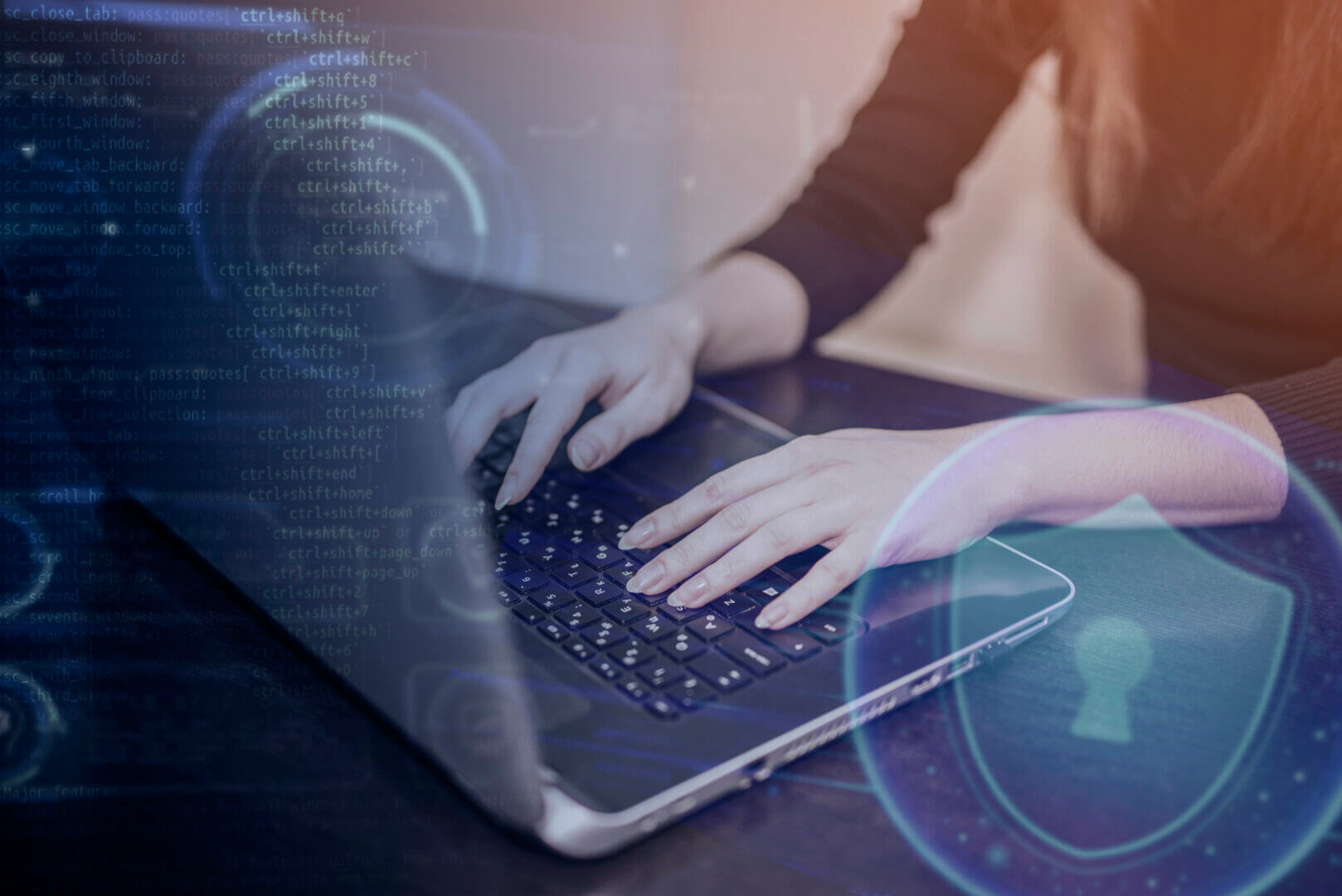 Profesional usando laptop con interfaz digital que ilustra la aplicación de DNN en ciberseguridad empresarial.