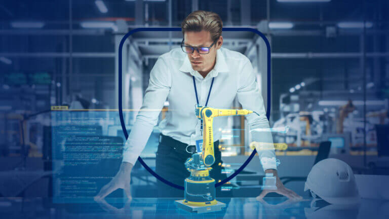 Un ingeniero observa un brazo robótico amarillo en una fábrica inteligente, ilustrando los usos de la inteligencia artificial por sector industrial en procesos de automatización.